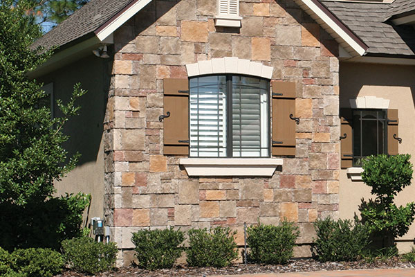 Cottage Shutters on Stone Home
